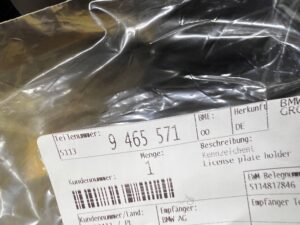 PODSTAWA RAMKA PRZEDNIEJ TABLICY REJESTRACYJNEJ PRZÓD USA MINI F60 NOWA OEM