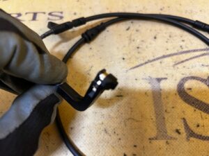 CZUJNIK ZUŻYCIA KLOCKÓW HAMULCOWYCH PRZÓD LEWY BMW X5 E70 X6 E71 NOWY OEM