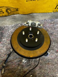 ZWROTNICA TARCZA ZACISK PIASTA TYŁ LEWY SUBARU FORESTER VI SL 25-