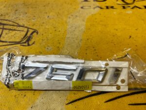 EMBLEMAT NAPIS ZNACZEK 750i BMW 7 G11 G12 750i 750iX NOWY OEM