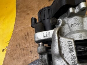 ZACISK HAMULCOWY ELEKTRYCZNY TYŁ LEWY FORD ESCAPE MK4 KUGA MK3