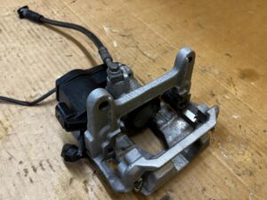 NOWY ZACISK HAMULCOWY ELEKTRYCZNY TYŁ LEWY AUDI A8 D5