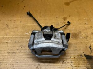 NOWY ZACISK HAMULCOWY ELEKTRYCZNY TYŁ LEWY AUDI A8 D5