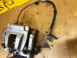 ZACISK HAMULCOWY ELEKTRYCZNY TYŁ LEWY LAND ROVER DISCOVERY V L462